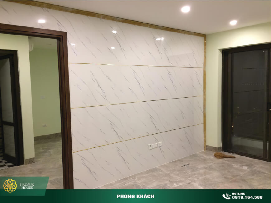 Thi công tấm nhựa pvc ốp tường vân đá phòng khách