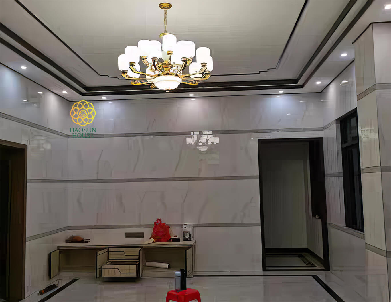 Thi công tấm pvc ốp tường giả đá phòng khách